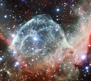 This VLT image of the Thor’s Helmet Nebula was taken on the occasion of ESO’s 50th Anniversary, 5 October 2012, with the help of Brigitte Bailleul — winner of the Tweet Your Way to the VLT! competition. The observations were broadcast live over the internet from the Paranal Observatory in Chile. This object, also known as NGC 2359, lies in the constellation of Canis Major (The Great Dog). The helmet-shaped nebula is around 15 000 light-years away from Earth and is over 30 light-years across. The helmet is a cosmic bubble, blown as the wind from the bright, massive star near the bubble's centre sweeps through the surrounding molecular cloud.